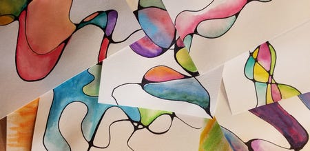 Several abstract watercolor paintings from the March 2026 List overlap each other, featuring organic, flowing shapes outlined in black and filled with vibrant, blended colors like pink, blue, green, and yellow. Several abstract watercolor paintings from the March 2026 List overlap each other, featuring organic, flowing shapes outlined in black and filled with vibrant, blended colors like pink, blue, green, and yellow.